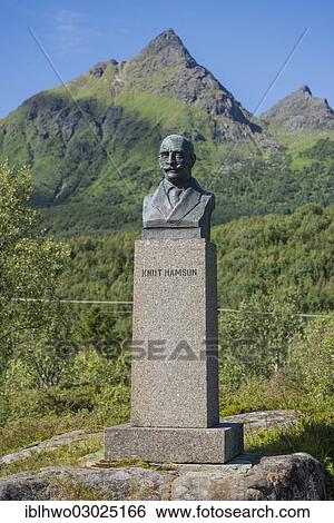 Stock Photograph - "Monument for Knut Hamsun, bronze bust on a stone plinth, in front of a mountain landscape, Ortsteil Hamsund, Kommune Hamaroy, Nordland, Northern Norway, Norway, Europe". Fotosearch
