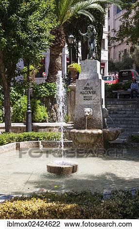 Monument of Joan Alcover at the former entrance to the Almudaina Palace, Palau de Almudaina, old town, Ciutat Antiga, Palma de Mallorca, Majorca, Balearic Islands, Spain, Europe View Large Photo Image Stock Image - Monument of Joan Alcover at the former entrance to the Almudaina Palace, Palau de Almudaina, old town, Ciutat Antiga, Palma de Mallorca, Majorca, Balearic Islands, Spain, Europe. Fotosearch