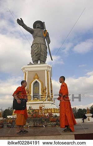 "Monument of the last King Chao Anouvong in Vientiane on the Mekong River, two Buddhist monks having a chat in front of it, Laos, Southeast Asia, Asia" View Large Photo Image Stock Image - "Monument of the last King Chao Anouvong in Vientiane on the Mekong River, two Buddhist monks having a chat in front of it, Laos, Southeast Asia, Asia". Fotosearch