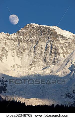 "Moon over Jungfrau Mountain, Bernese Oberland, Switzerland, Europe" View Large Photo Image Stock Photo - "Moon over Jungfrau Mountain, Bernese Oberland, Switzerland, Europe". Fotosearch