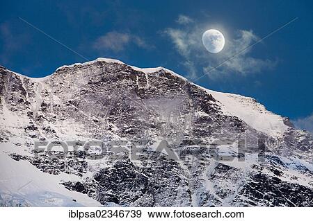 "Moon over the Bernese Alps, Grimmelwald, Bernese Oberland, Switzerland, Europe" View Large Photo Image Stock Photo - "Moon over the Bernese Alps, Grimmelwald, Bernese Oberland, Switzerland, Europe". Fotosearch