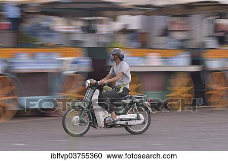 "Moped rider at Djemaa el Fna market square, historic center, Marrakesh, Marrakesh-Tensift-El Haouz region, Morocco, Africa" View Large Photo Image Stock Image - "Moped rider at Djemaa el Fna market square, historic center, Marrakesh, Marrakesh-Tensift-El Haouz region, Morocco, Africa". Fotosearch