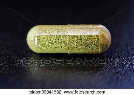 Moringa powder in a capsule View Large Photo Image Stock Image - Moringa powder in a capsule. Fotosearch