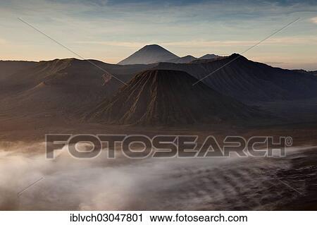 "Morning fog in the Tengger Caldera with Mount Bromo volcano, left crater, Batok Volcano, front right, and Gunung Semeru volcano at the rear, Bromo Tengger Semeru National Park, Eastern Java, Java, Indonesia, Asia" View Large Photo Image Stock Image - "Morning fog in the Tengger Caldera with Mount Bromo volcano, left crater, Batok Volcano, front right, and Gunung Semeru volcano at the rear, Bromo Tengger Semeru National Park, Eastern Java, Java, Indonesia, Asia". Fotosearch