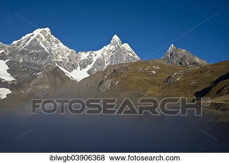"Morning mist on lake Laguna Carhuacocha, at the back Mt Yerupaja Chico and Mt Jirishanca Grande, Cordillera Huayhuash mountain range, Northern Peru, Peru, South America" View Large Photo Image Stock Photo - "Morning mist on lake Laguna Carhuacocha, at the back Mt Yerupaja Chico and Mt Jirishanca Grande, Cordillera Huayhuash mountain range, Northern Peru, Peru, South America". Fotosearch