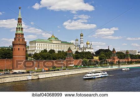 Stock Photo - "Moscow Kremlin with Grand Kremlin Palace, Cathedral of the Archangel, Cathedral of the Annunciation and the bell tower of Ivan the Great, excursion boat, Moskva River, Moscow, Russia, Europe". Fotosearch