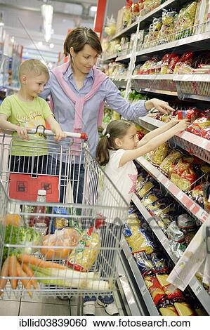 "Mother and children shopping for food, woman 35 years, girl 7 years and a boy 5 years" View Large Photo Image Stock Image - "Mother and children shopping for food, woman 35 years, girl 7 years and a boy 5 years". Fotosearch