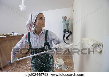 "Mother and daughter renovating a room, painting the walls with paint rollers" View Large Photo Image Stock Image - "Mother and daughter renovating a room, painting the walls with paint rollers". Fotosearch