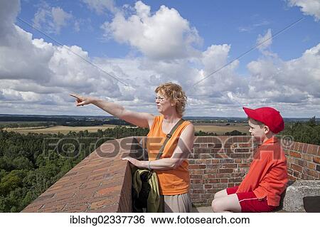 "Mother and son sitting on a viewing tower, Teterow, Mecklenburgische Schweiz region, Mecklenburg-Western Pomerania, Germany, Europe" View Large Photo Image Stock Photograph - "Mother and son sitting on a viewing tower, Teterow, Mecklenburgische Schweiz region, Mecklenburg-Western Pomerania, Germany, Europe". Fotosearch