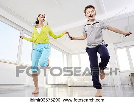 "Mother and son skipping rope, Germany, Europe" View Large Photo Image Stock Image - "Mother and son skipping rope, Germany, Europe". Fotosearch