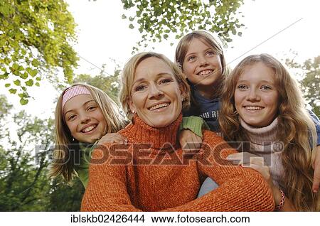 Mother and three daughters outdoors View Large Photo Image Picture - Mother and three daughters outdoors. Fotosearch