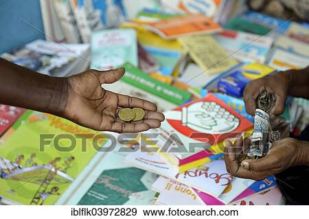 "Mother buys school books on the market, Camp Icare for earthquake refugees, Fort National, Port-au-Prince, Haiti, North America" View Large Photo Image Stock Photo - "Mother buys school books on the market, Camp Icare for earthquake refugees, Fort National, Port-au-Prince, Haiti, North America". Fotosearch