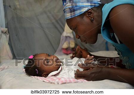"Mother with baby, Camp Icare for earthquake refugees, Fort National, Port-au-Prince, Haiti, North America" View Large Photo Image Stock Photography - "Mother with baby, Camp Icare for earthquake refugees, Fort National, Port-au-Prince, Haiti, North America". Fotosearch