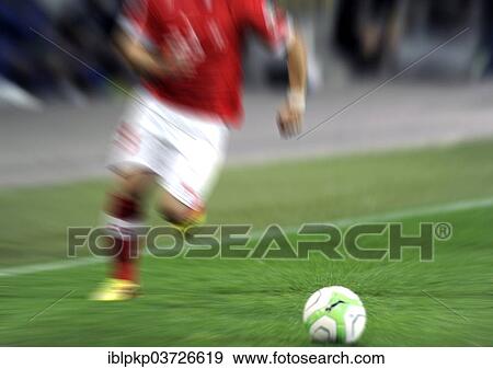 "Motion blur of a soccer player in action with a ball, Bern, Canton of Bern, Switzerland, Europe" View Large Photo Image Stock Photo - "Motion blur of a soccer player in action with a ball, Bern, Canton of Bern, Switzerland, Europe". Fotosearch