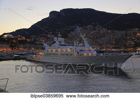 "Motor yacht Atlantis II in the evening in Port Hercule, Prince's Palace at the back, Principality of Monaco" View Large Photo Image Stock Photography - "Motor yacht Atlantis II in the evening in Port Hercule, Prince's Palace at the back, Principality of Monaco". Fotosearch
