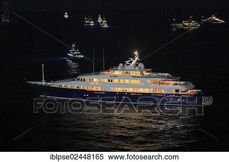 "Motor yacht """"Laurel"""", built by shipyard """"Delta Marine"""", 73. 15m in length, built in 2006, sailing out of Port Hercule at night, Monaco, Cote d'Azur, Mediterranean, Europe" View Large Photo Image Stock Photography - "Motor yacht """"Laurel"""", built by shipyard """"Delta Marine"""", 73. 15m in length, built in 2006, sailing out of Port Hercule at night, Monaco, Cote d'Azur, Mediterranean, Europe". Fotosearch