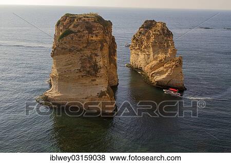 "Motorboat between El Rawsheh Rock or Pigeon Rocks, Beirut, Lebanon, Asia" View Large Photo Image Stock Photo - "Motorboat between El Rawsheh Rock or Pigeon Rocks, Beirut, Lebanon, Asia". Fotosearch