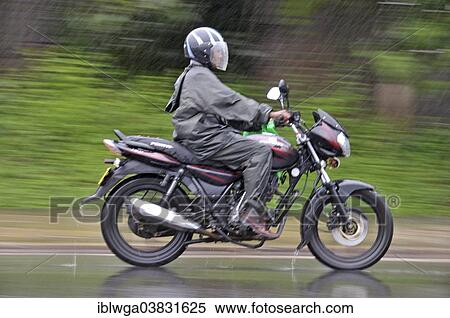 "Motorcycle in heavy rain, Sri Lanka, Asia" View Large Photo Image Stock Photography - "Motorcycle in heavy rain, Sri Lanka, Asia". Fotosearch