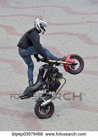 "Motorcycle stunt rider performing, Cha Am, Thailand, Asia" View Large Photo Image Stock Photo - "Motorcycle stunt rider performing, Cha Am, Thailand, Asia". Fotosearch