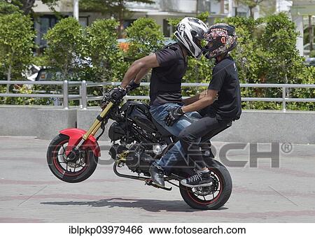 "Motorcycle stunt rider performing, Cha Am, Thailand, Asia" View Large Photo Image Stock Photograph - "Motorcycle stunt rider performing, Cha Am, Thailand, Asia". Fotosearch