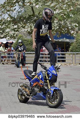 "Motorcycle stunt rider performing, Cha Am, Thailand, Asia" View Large Photo Image Stock Photography - "Motorcycle stunt rider performing, Cha Am, Thailand, Asia". Fotosearch