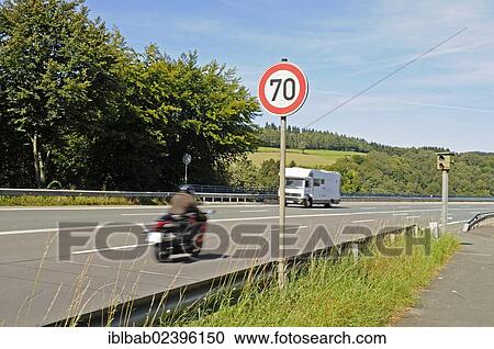 Stock Image - "Motorcycle, traffic, speed limit enforcement, traffic control, country road, Talbruecke Ronnewinkel bridge, Olpe, Ebbegebirge nature park Park, Sauerland, North Rhine-Westphalia, Germany, Europe, PublicGround, Europe". Fotosearch