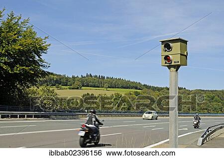 Stock Photograph - "Motorcycle, traffic, speed limit enforcement, traffic control, country road, Talbruecke Ronnewinkel bridge, Olpe, Ebbegebirge nature park Park, Sauerland, North Rhine-Westphalia, Germany, Europe, PublicGround, Europe". Fotosearch