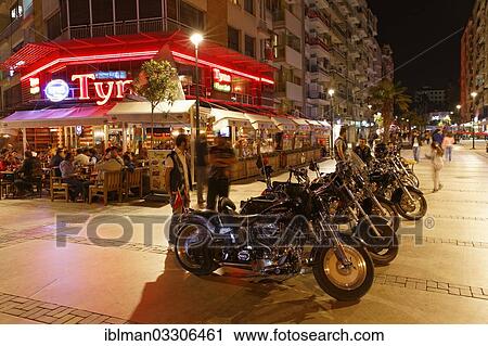 Stock Image - "Motorcycles in front of a restaurant, Alsancak, Izmir, Izmir Province, Aegean Region, Turkey, Asia". Fotosearch