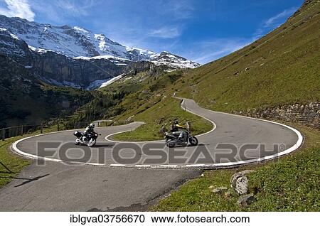 "Motorcyclists in a hairpin curve, mountain road to the Klausen Pass in front of the Glarus Alps, Urnerboden, Canton of Uri, Switzerland, Europe" View Large Photo Image Stock Image - "Motorcyclists in a hairpin curve, mountain road to the Klausen Pass in front of the Glarus Alps, Urnerboden, Canton of Uri, Switzerland, Europe". Fotosearch