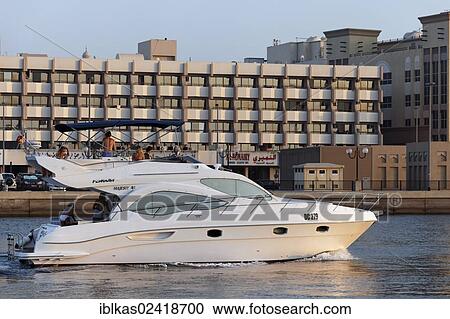 Stock Image - Motoryacht, Gulf Craft Majesty 44 on Dubai Creek, Dubai, United Arab Emirates, Middle East, Asia. Fotosearch