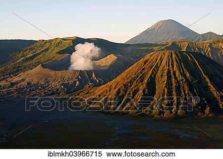 Stock Photography - "Mount Bromo, smoking, Mount Batok, right, Mount Kursi and Mount Gunung Semeru at the back, volcanoes, Bromo-Tengger-Semeru National Park, Java, Indonesia, Asia". Fotosearch