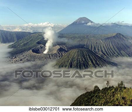 "Mount Bromo with smoke, Mount Batok at front, Mt Kursi and Mt Gunung Semeru at back, volcano, eruption, Bromo Tengger Semeru National Park, Mount Bromo, Java, Indonesia, Asia" View Large Photo Image Stock Image - "Mount Bromo with smoke, Mount Batok at front, Mt Kursi and Mt Gunung Semeru at back, volcano, eruption, Bromo Tengger Semeru National Park, Mount Bromo, Java, Indonesia, Asia". Fotosearch