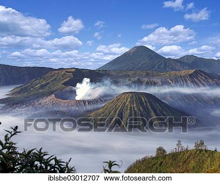 "Mount Bromo with smoke, Mount Batok at front, Mt Kursi and Mt Gunung Semeru at back, volcano, eruption, Bromo Tengger Semeru National Park, Mount Bromo, Java, Indonesia, Asia" View Large Photo Image Stock Photo - "Mount Bromo with smoke, Mount Batok at front, Mt Kursi and Mt Gunung Semeru at back, volcano, eruption, Bromo Tengger Semeru National Park, Mount Bromo, Java, Indonesia, Asia". Fotosearch