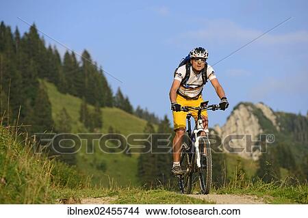 "Mountain biker at Mount Hochgern, Chiemgau, Bavaria, Germany, Europe" View Large Photo Image Picture - "Mountain biker at Mount Hochgern, Chiemgau, Bavaria, Germany, Europe". Fotosearch