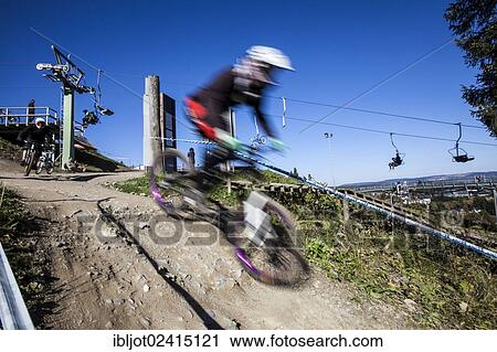 Mountain biker, bike park, downhill mountain bike trail at the Winterberg bobsleigh track, a converted ski lift is used to transport mountain bikers and their bikes up the mountain, Sauerland, North Rhine-Westphalia, Germany, Europe View Large Photo Image Stock Image - Mountain biker, bike park, downhill mountain bike trail at the Winterberg bobsleigh track, a converted ski lift is used to transport mountain bikers and their bikes up the mountain, Sauerland, North Rhine-Westphalia, Germany, Europe. Fotosearch