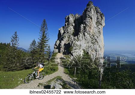 "Mountain biker in front of Staffelstein, Kampenwand Mountain, Chiemgau, Upper Bavaria, Bavaria, Germany, Europe" View Large Photo Image Stock Image - "Mountain biker in front of Staffelstein, Kampenwand Mountain, Chiemgau, Upper Bavaria, Bavaria, Germany, Europe". Fotosearch