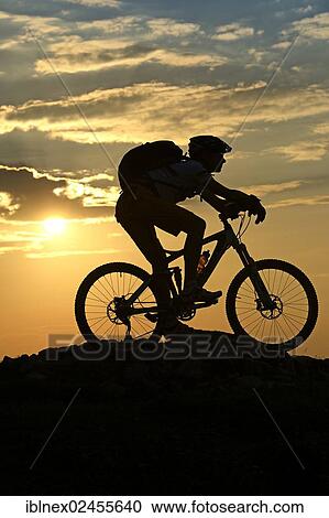 "Mountain biker on Kampenwand Mountain, silhouette against the light, Chiemgau, Upper Bavaria, Bavaria, Germany, Europe" View Large Photo Image Stock Image - "Mountain biker on Kampenwand Mountain, silhouette against the light, Chiemgau, Upper Bavaria, Bavaria, Germany, Europe". Fotosearch