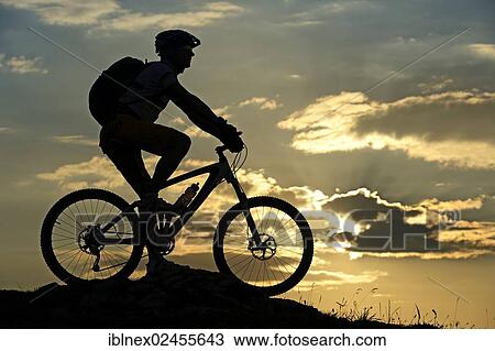 "Mountain biker on Kampenwand Mountain, silhouette against the light, Chiemgau, Upper Bavaria, Bavaria, Germany, Europe" View Large Photo Image Stock Image - "Mountain biker on Kampenwand Mountain, silhouette against the light, Chiemgau, Upper Bavaria, Bavaria, Germany, Europe". Fotosearch