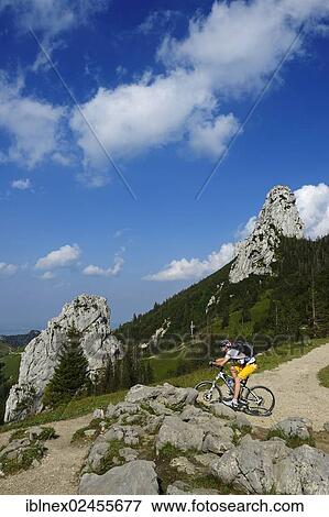 Stock Photo - "Mountain bikers at Mount Kampenwand, Staffelstein, Chiemgau region, Upper Bavaria, Bavaria, Germany, Europe". Fotosearch