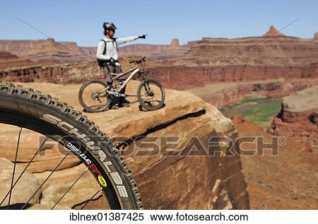 Stock Photography - "Mountain bikers, Colorado River, White Rim Trail, Moab, Utah, USA". Fotosearch