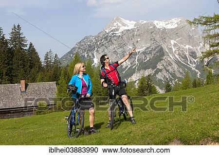 "Mountain bikers on a mountain pasture, Gesause region, Styria, Austria, Europe" View Large Photo Image Stock Image - "Mountain bikers on a mountain pasture, Gesause region, Styria, Austria, Europe". Fotosearch