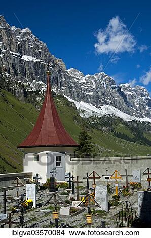 "Mountain cemetery at the St. Erhard chapel at the foot of the Glarus Alps, Urnerboden, Spiringen, Canton of Uri, Switzerland, Europe" View Large Photo Image Picture - "Mountain cemetery at the St. Erhard chapel at the foot of the Glarus Alps, Urnerboden, Spiringen, Canton of Uri, Switzerland, Europe". Fotosearch