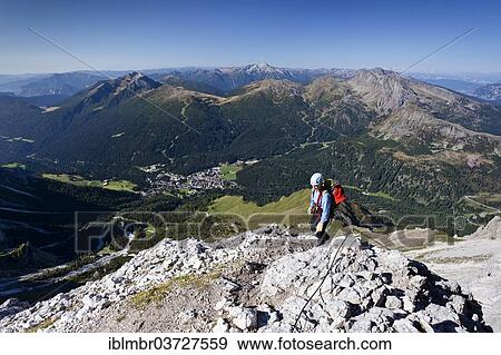 "Mountain climber ascending the Via Ferrata Bolver Lugli climbing route on Cima di Vezzana Mountain, Trentino Province, Trentino-Alto Adige, Italy, Europe" View Large Photo Image Stock Photo - "Mountain climber ascending the Via Ferrata Bolver Lugli climbing route on Cima di Vezzana Mountain, Trentino Province, Trentino-Alto Adige, Italy, Europe". Fotosearch