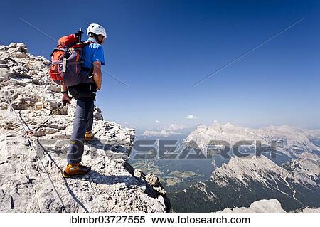 "Mountain climber ascending the Via Ferrata Marino Bianchi climbing route on Monte Cristallo, overlooking the Tofane Mountains, Belluno province, Italy, Europe" View Large Photo Image Stock Photography - "Mountain climber ascending the Via Ferrata Marino Bianchi climbing route on Monte Cristallo, overlooking the Tofane Mountains, Belluno province, Italy, Europe". Fotosearch