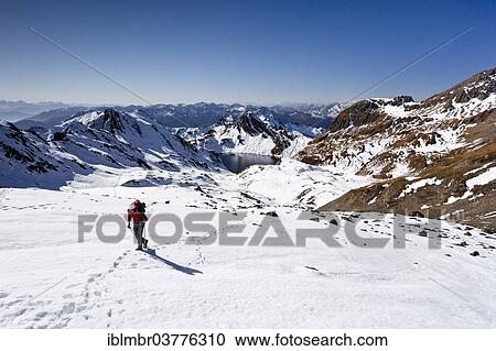 "Mountain climber ascending Wilde Kreuzspitze Mountain in the Pfunderer Mountains, above Wildensee lake, Alto Adige, Italy, Europe" View Large Photo Image Stock Image - "Mountain climber ascending Wilde Kreuzspitze Mountain in the Pfunderer Mountains, above Wildensee lake, Alto Adige, Italy, Europe". Fotosearch