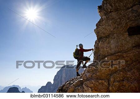 "Mountain climber climbing the Marino Bianchi climbing route on Monte Cristallo to the summit of Cristallo di Mezzo, Dolomites, oberhalb von Cortina d'Ampezzo, Province of Belluno, Veneto, Italy, Europe" View Large Photo Image Stock Photograph - "Mountain climber climbing the Marino Bianchi climbing route on Monte Cristallo to the summit of Cristallo di Mezzo, Dolomites, oberhalb von Cortina d'Ampezzo, Province of Belluno, Veneto, Italy, Europe". Fotosearch
