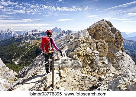 "Mountain climber descending from Lagazuoi Mountain in the Fanes Group, in front of Pelmo Mountain, Dolomites, Belluno, Italy, Europe" View Large Photo Image Stock Photography - "Mountain climber descending from Lagazuoi Mountain in the Fanes Group, in front of Pelmo Mountain, Dolomites, Belluno, Italy, Europe". Fotosearch