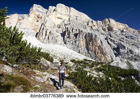 Stock Photo - "Mountain climber descending the Heiligkreuzkofelsteig climbing route on Heiligkreuzkofel Mountain in the Fanes Group, in Fanes-Sennes-Prags Nature Park, Dolomites, Alto Adige, Italy, Europe". Fotosearch