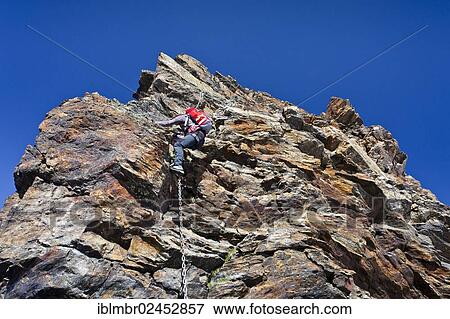 "Mountain climber during the ascent of Schneebiger Nock Mountain on a climbing route in the Rieserferner Group in the Puster Valley, Alto Adige, Italy, Europe" View Large Photo Image Stock Photo - "Mountain climber during the ascent of Schneebiger Nock Mountain on a climbing route in the Rieserferner Group in the Puster Valley, Alto Adige, Italy, Europe". Fotosearch