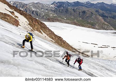 Stock Image - "Mountain climber inspection an edge, safety, Zufallferner Gletscher, Martelltal, South Tyrol province, Trentino-Alto Adige, Italy, Europe". Fotosearch